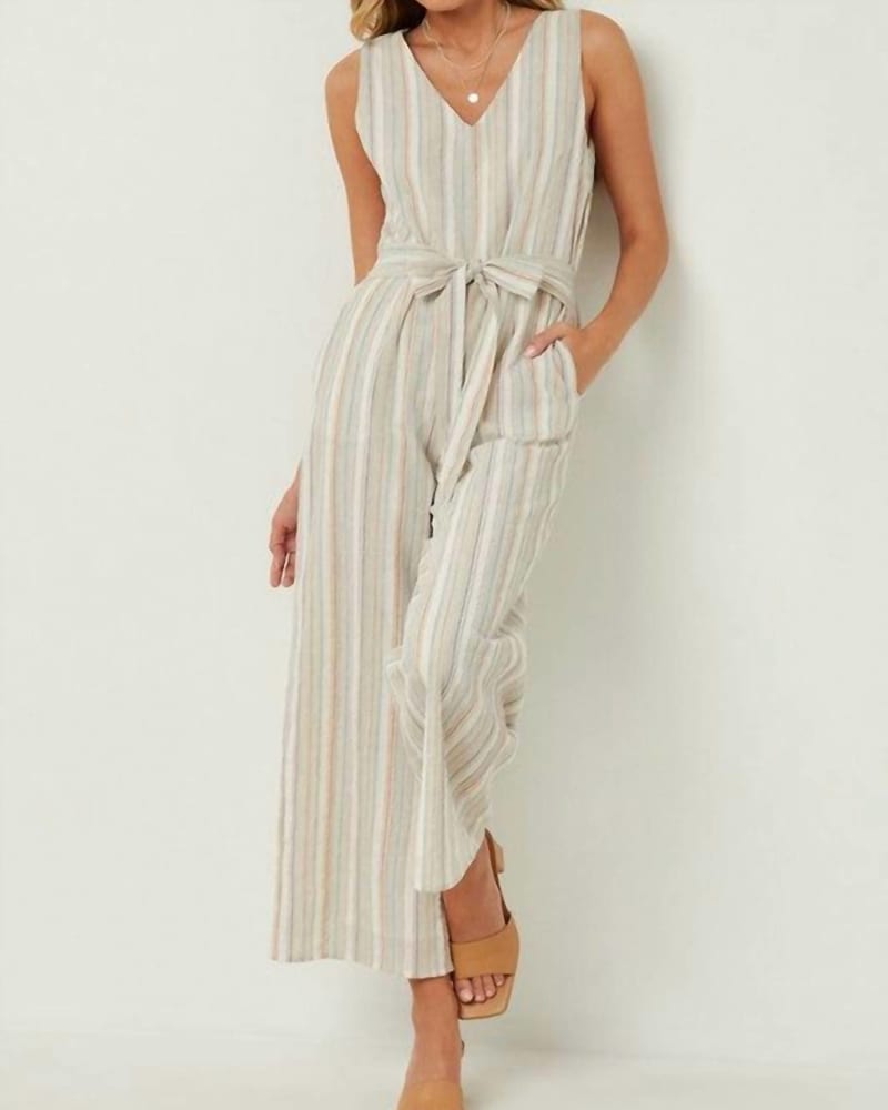 Front of a model wearing a size Large Steal A Glance Striped Jumpsuit In Ivory in Ivory by Hayden LA. | dia_product_style_image_id:356402